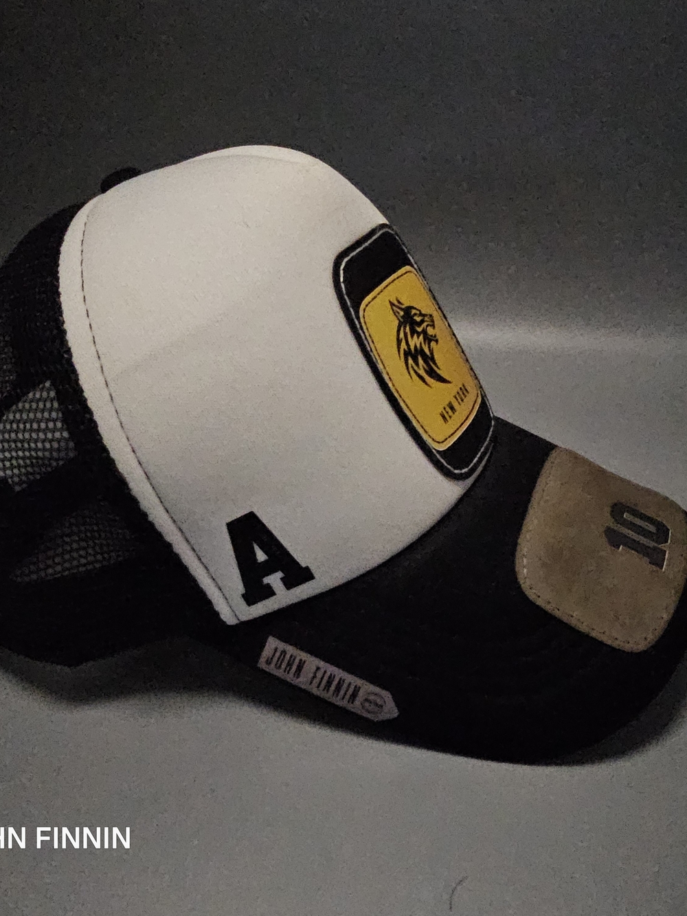 White and Black Trucker Cap with Yellow Patch